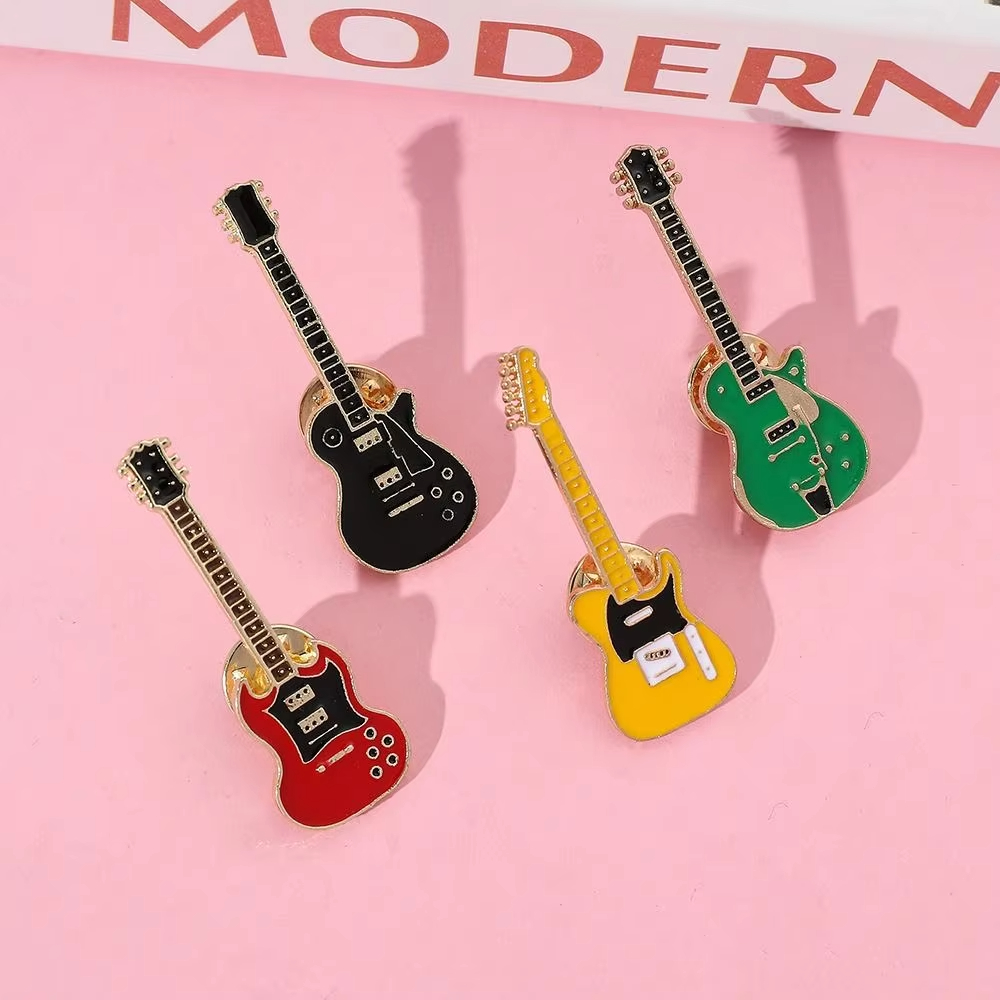 Broche de guitarra de metal es - Musical Instrument Symbols reseña y precio